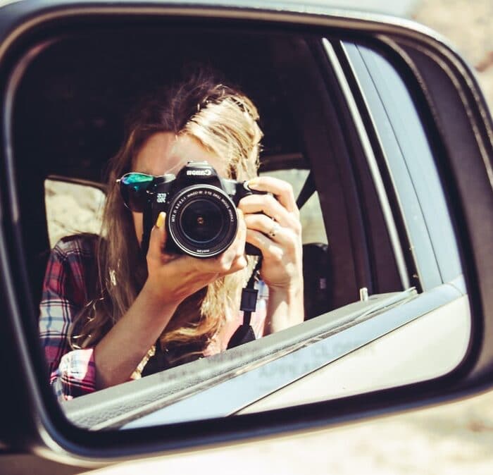 camera in car mirror, woman, influencer