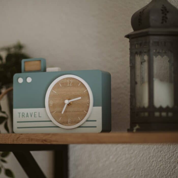 camera clock on a shelf