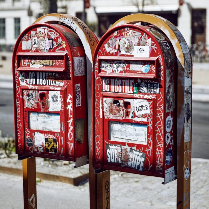 mailboxes covered in stickers