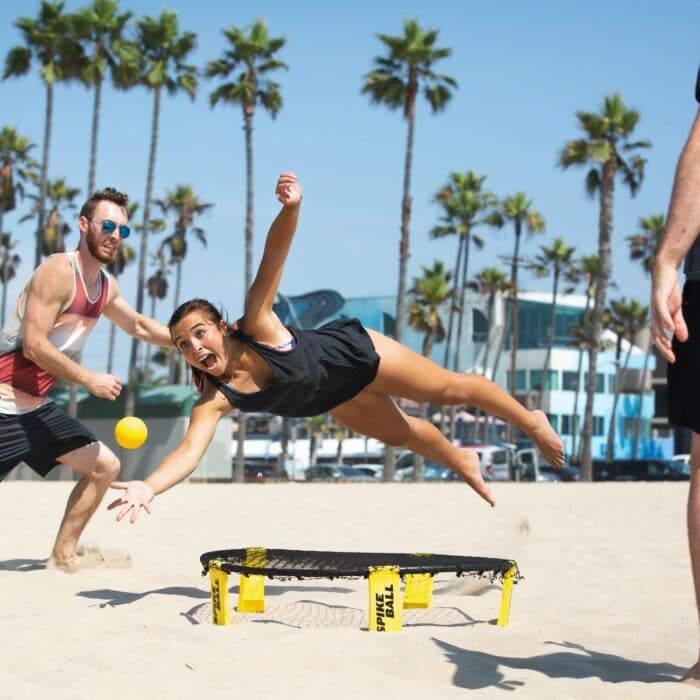 woman on beach on a trampoline funny goofy