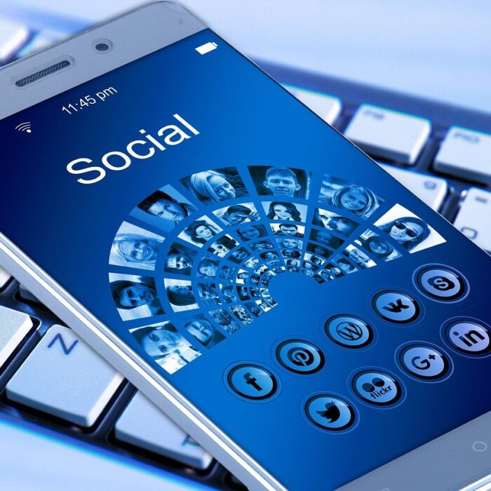 social media on mobile phone blue