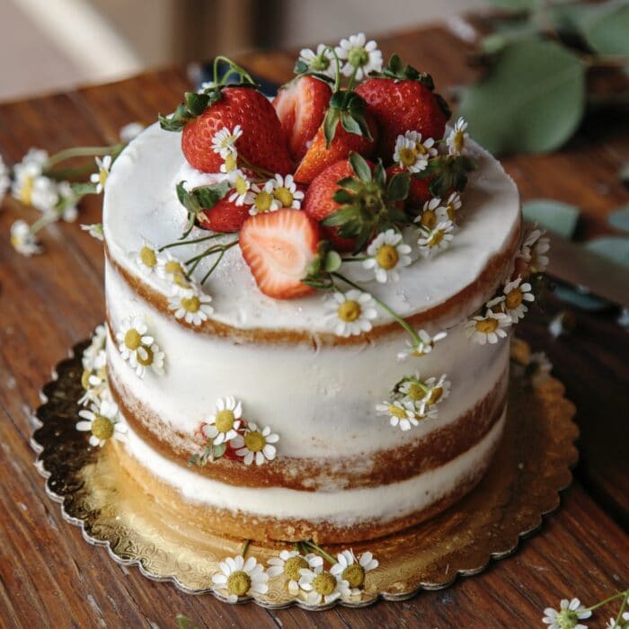 cake with strawberries and flowers