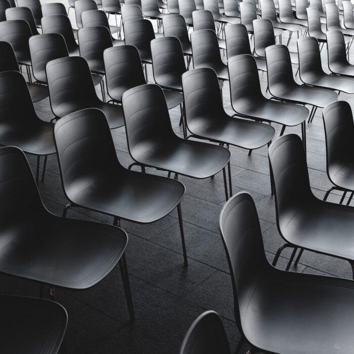 group of chairs followers audience empty