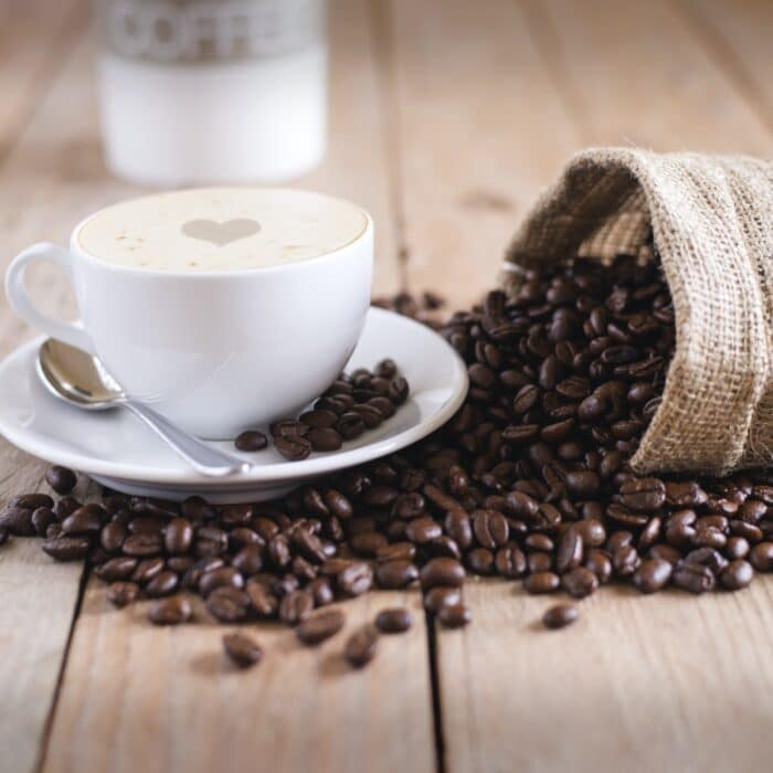 coffee beans with a coffee cup with a phone