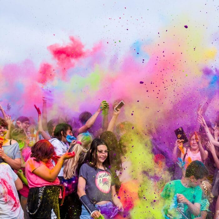 woman in dust color bright air celebrate party