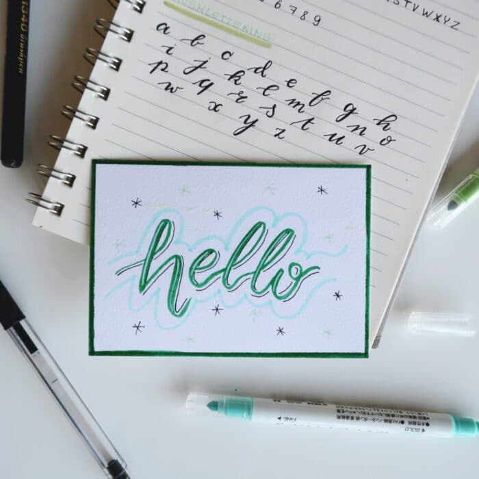 hello font writing on notebook