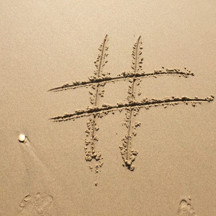 hashtag written in the sand