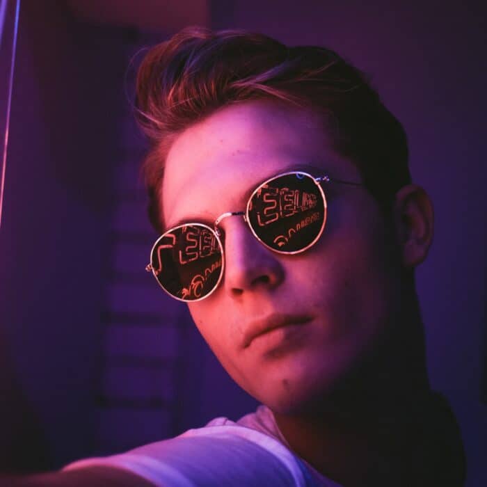 man wearing sunglasses with lights in them