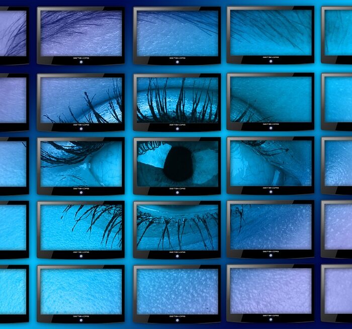 woman eye in monitors with tv