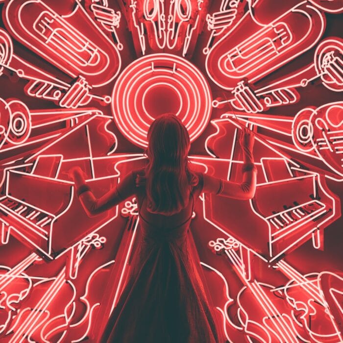 woman surrounded by music and light symbols