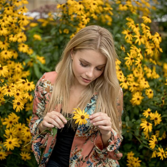 woman holding a flower influencer