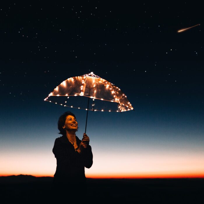 woman holding star umbrella outside influencer