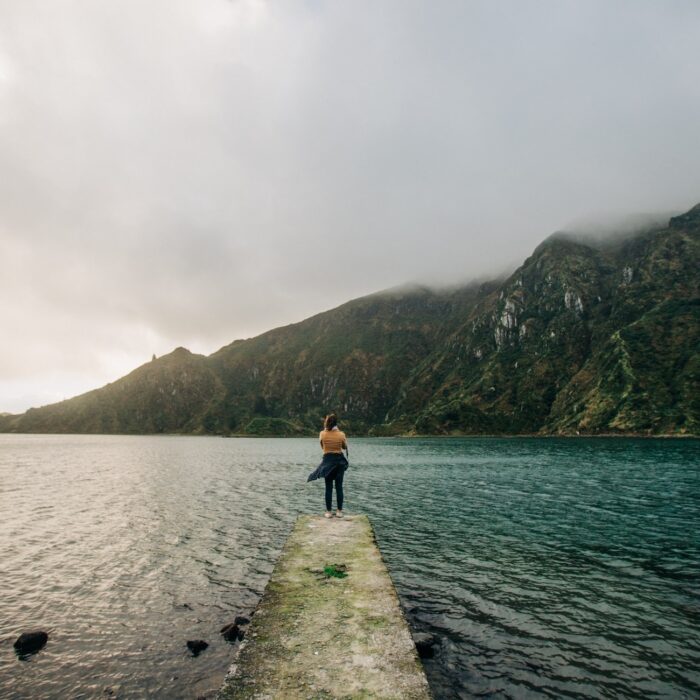 woman standing on a dock landscape influencer