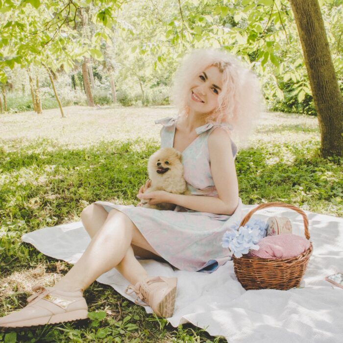 woman on a picnic with her dog