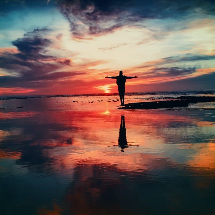 man in ocean sunset