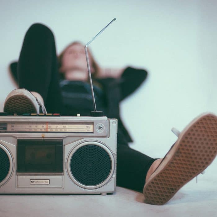 woman with foot on radio