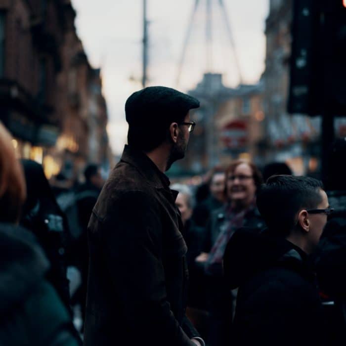 man standing in a crowd