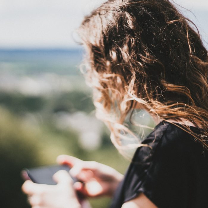 woman holding phone