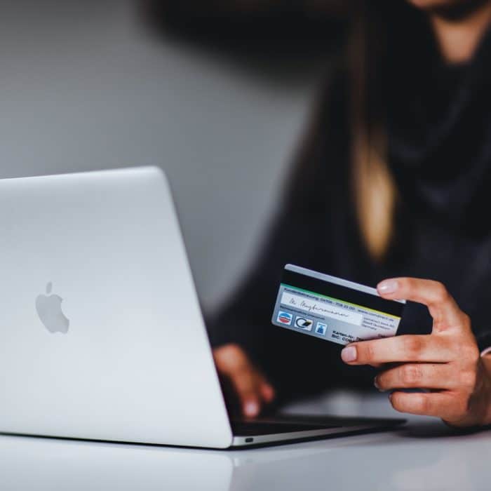 woman with credit card and computer