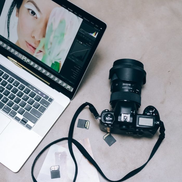 photo editing of woman with green hair on desktop with camera