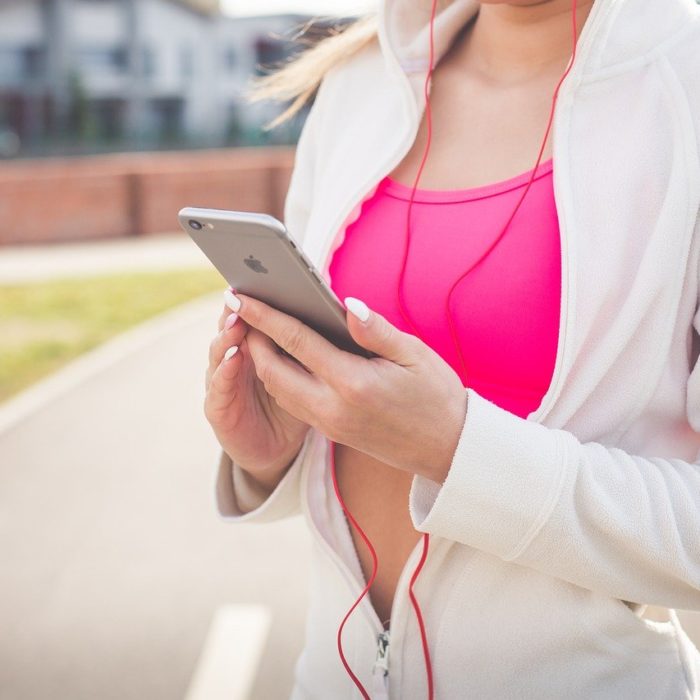 fit woman with iphone