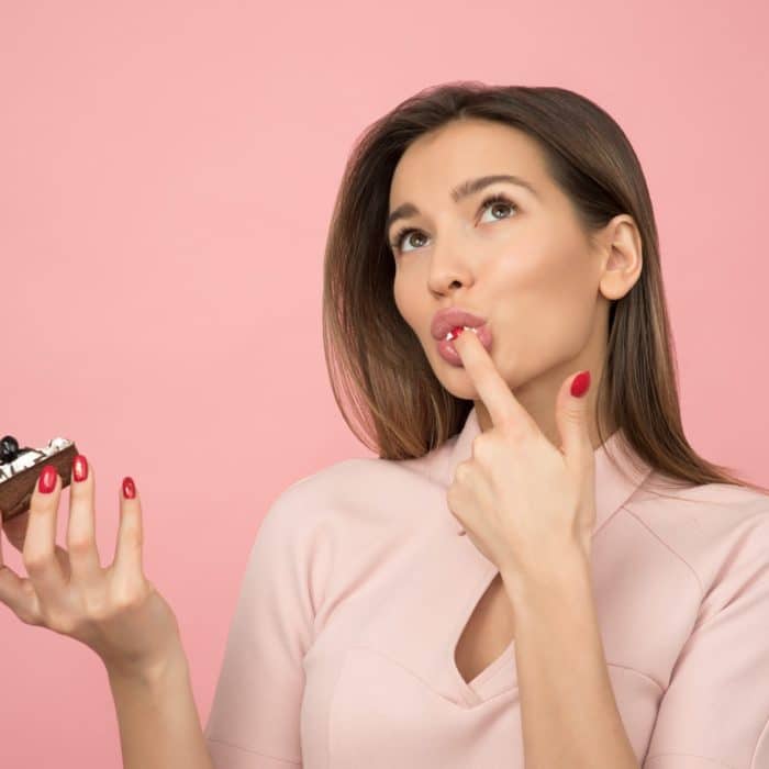 woman eating cupcake