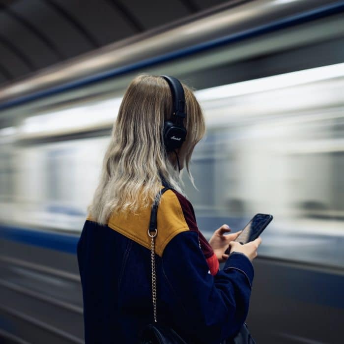 woman headphones train