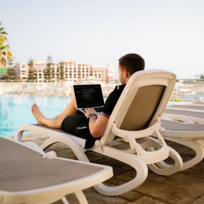 Man Lounging Near a Pool