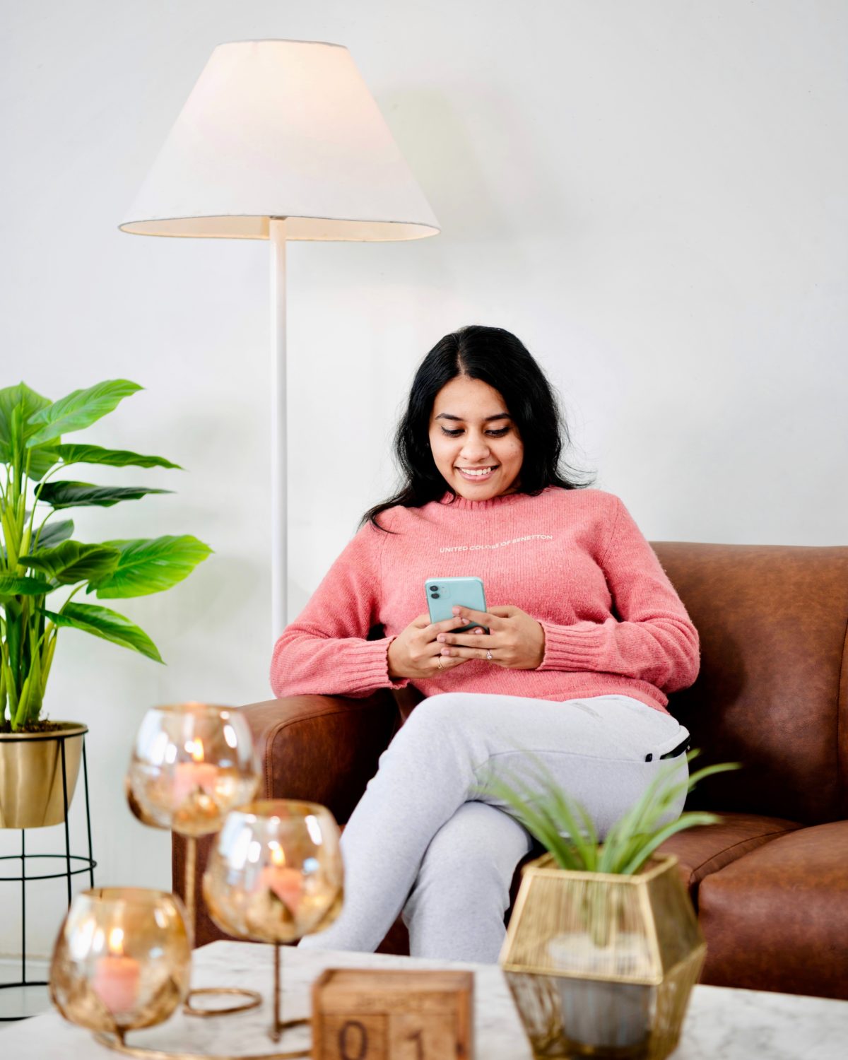 Woman Smiling Holding Phone