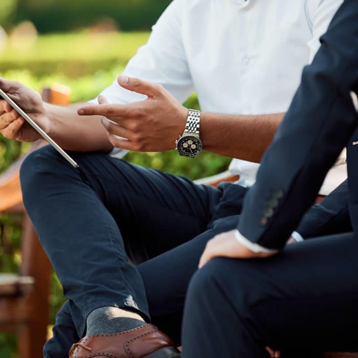 Two Business People Viewing Phone