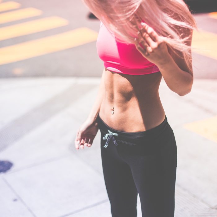 fitness model posing on the street