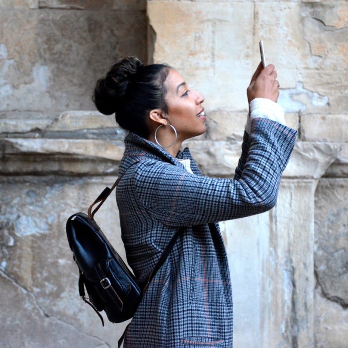 Woman Looking Up Holding Phone