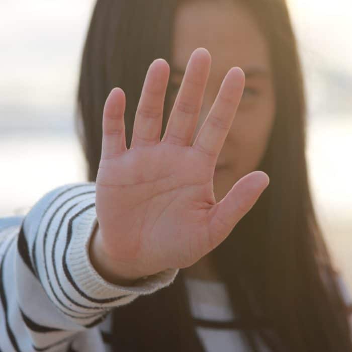 Woman Holding Up A Hand