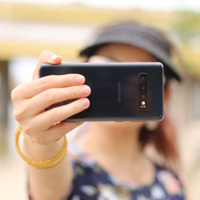 Woman Holding Phone Camera