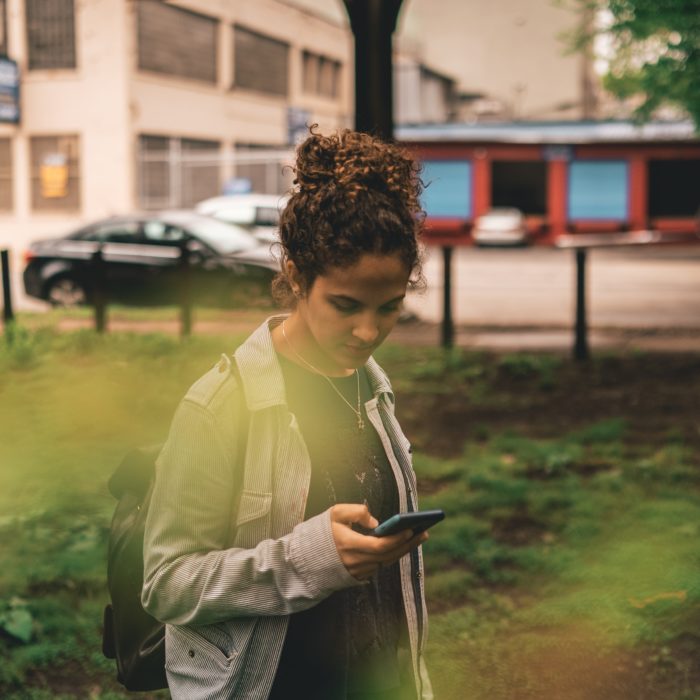 Worried Woman Looking at her Phone