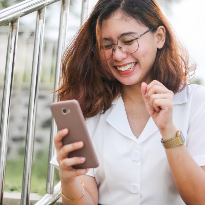 Smiling Woman with Phone