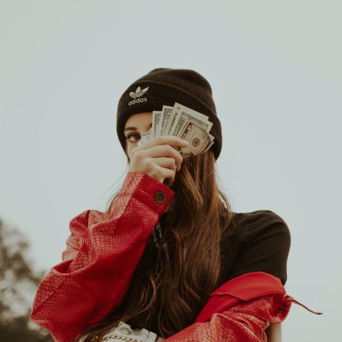 Influencer Holding Dollar Bills