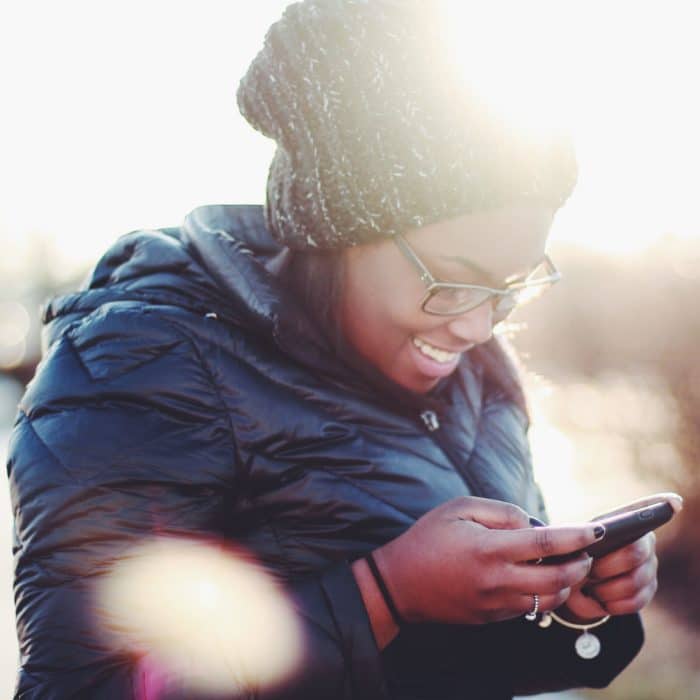 Happy Woman Holding Phone