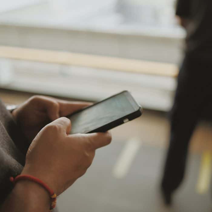 Hands Typing on a Phone