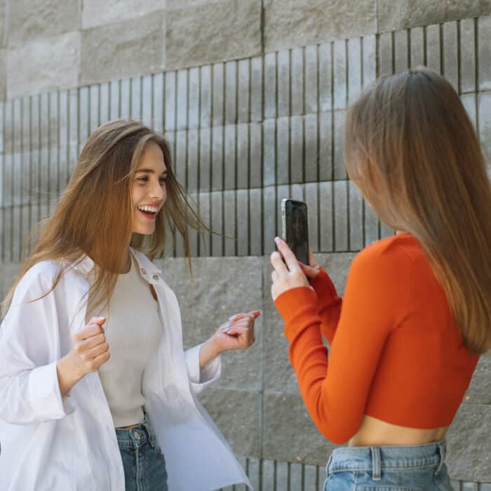 Two teenagers using social media