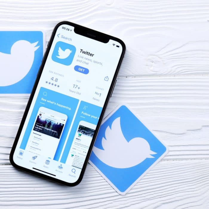 Phone With Twitter Logo on White Wood Background