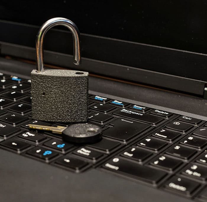 Padlock and key on a keyboard