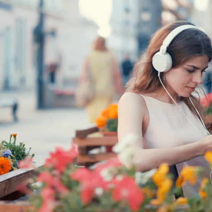 Young girl listening to music outdoors